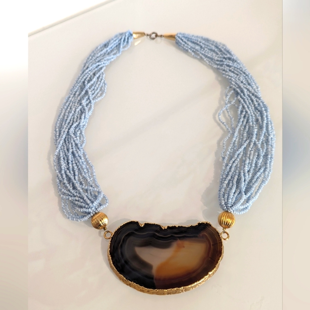 Gold edged brown Agathe slice / light blue bead necklace